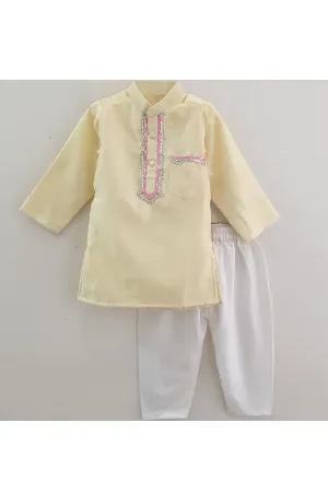 Pastel yellow lace work kurta with white pyjama